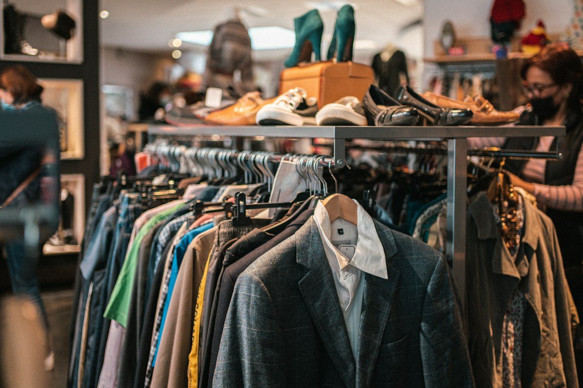 Clothes and shoes displayed in a vintage clothing shop