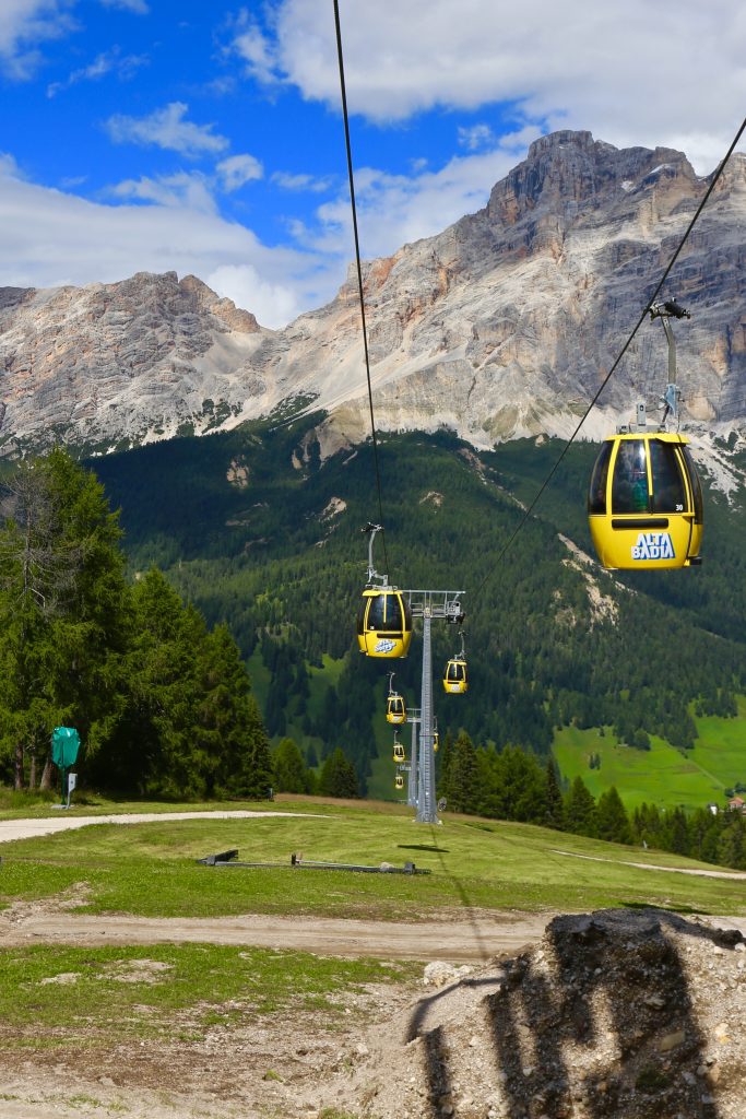 view of the yellow cable cars at the top of a peak.