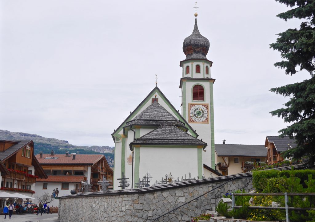 view of a clock tower in San Cassiano, Italy
