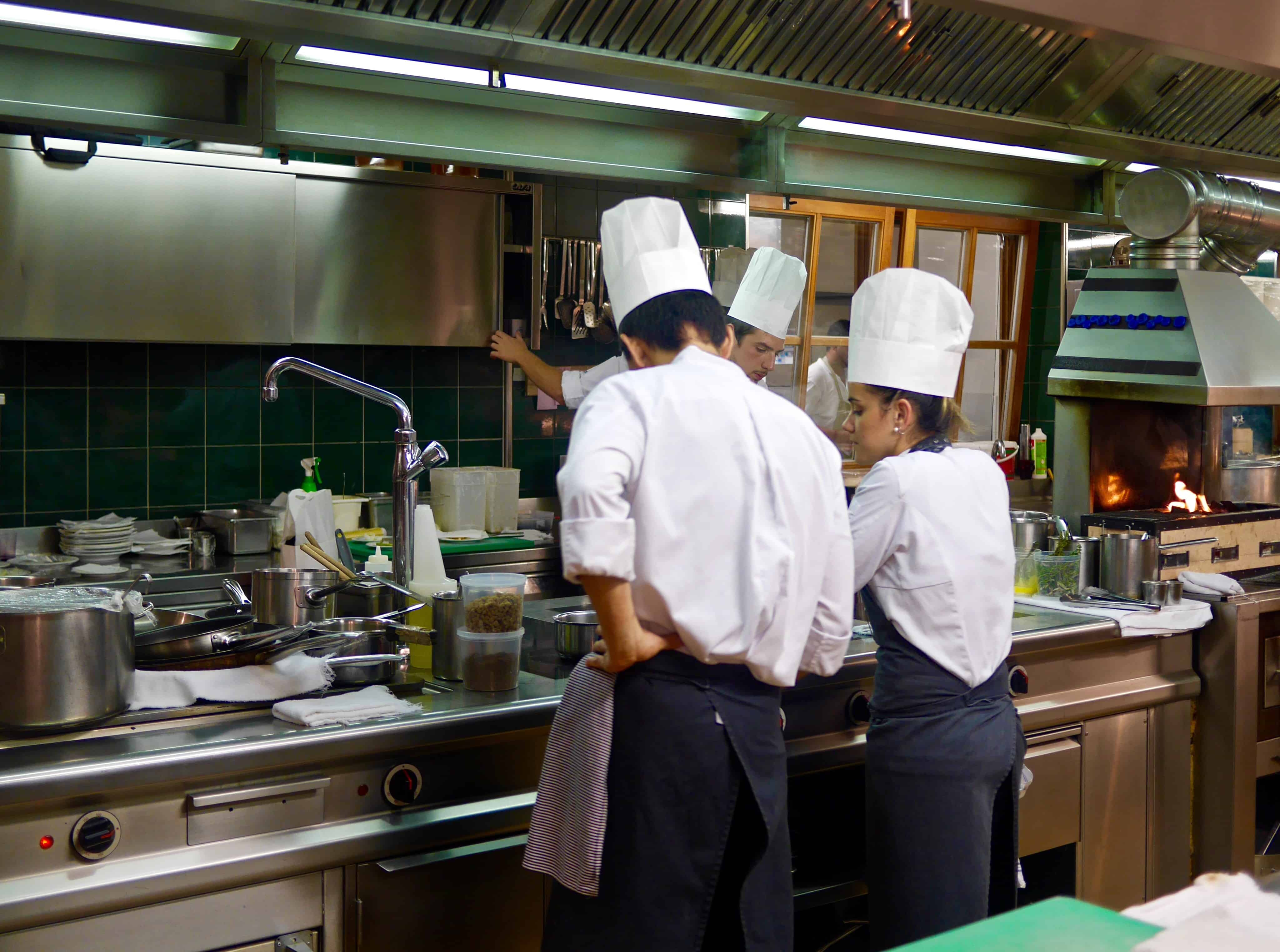 in the kitchen with chefs of Restaurant St. Hubertus - San Cassiano
