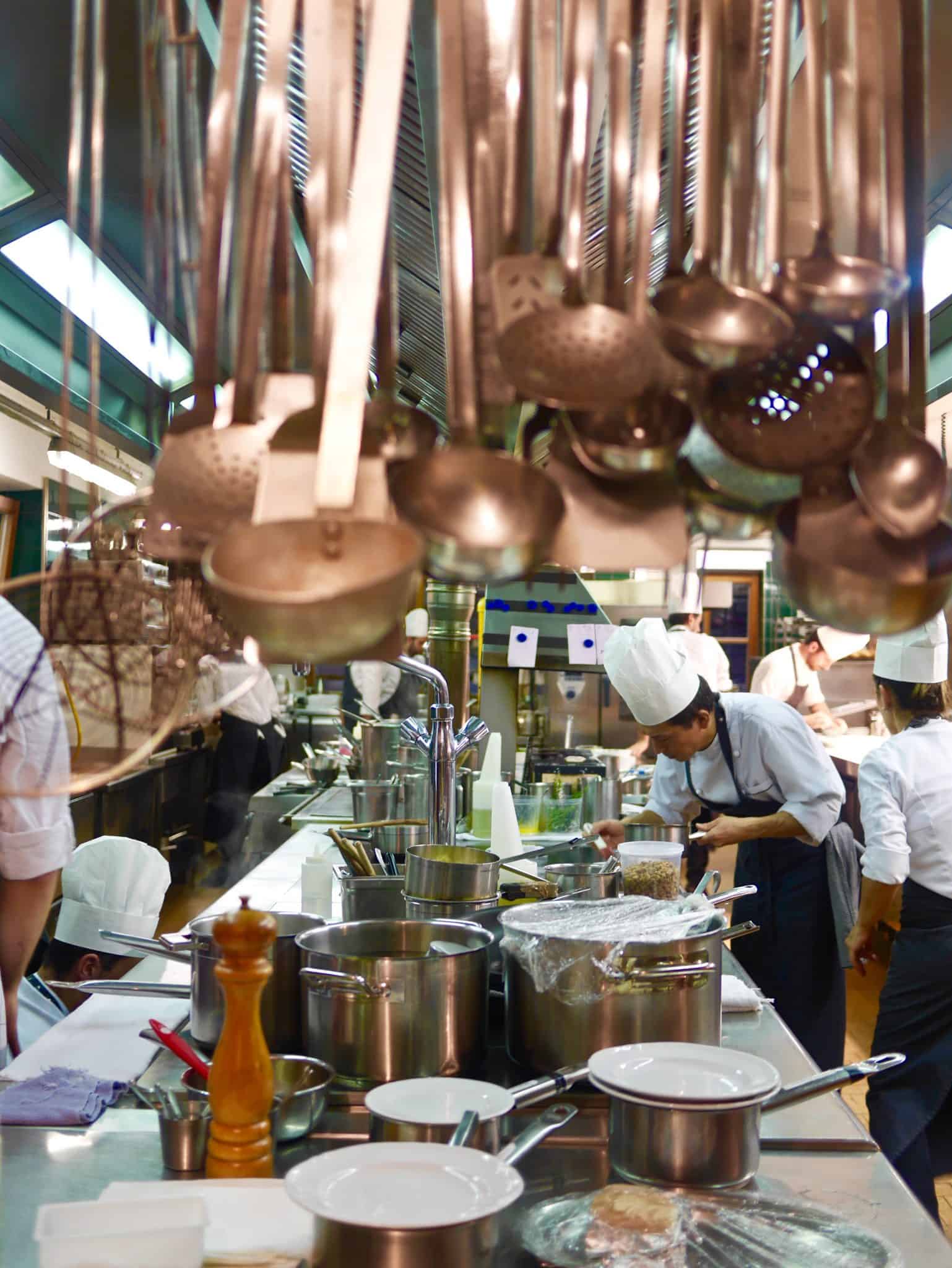 in the kitchen with brass ladels in the foreground