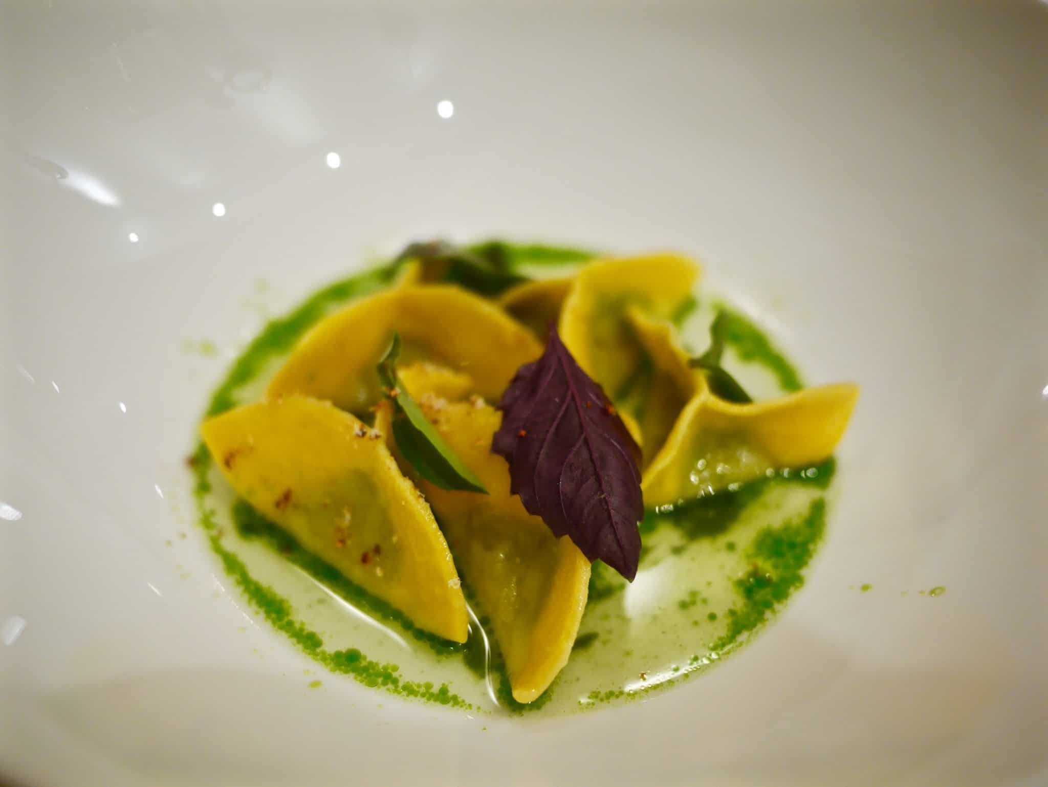 ravioli stuffed with ricotta from El Brite farm with basil pesto, buttermilk and cheese crust