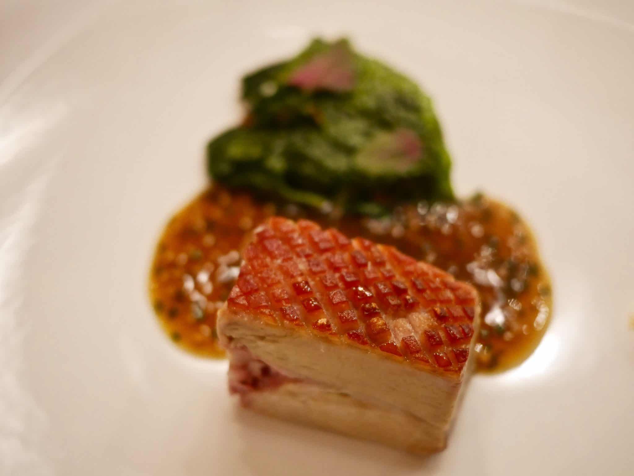 crispy local suckling pig with pig head sandwich and mustard