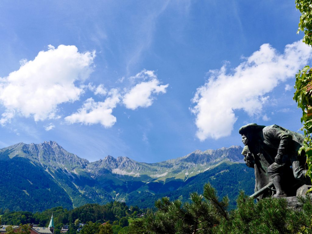 looking up at the mountains towards the blu sky