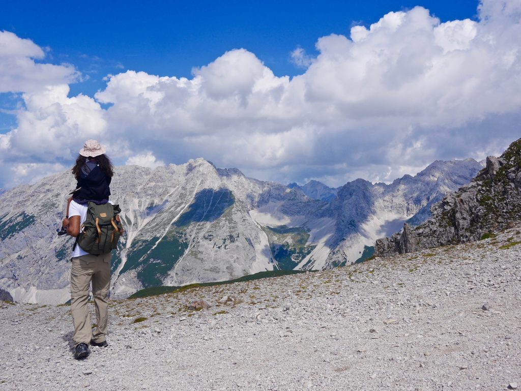 girl on shoulders of father overlooking the mountains