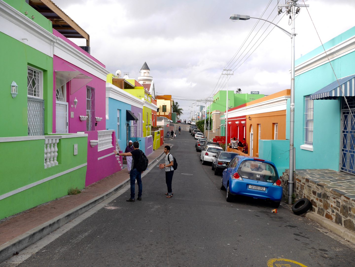 looking down a road in Bo-Kaap in Cape Town surrounded by multi coloured buildings