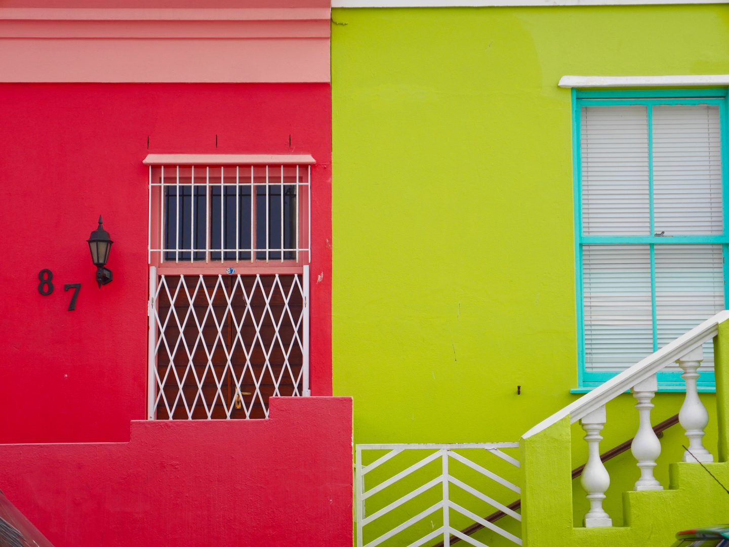red and green building alongside each other in Bo-Kaap