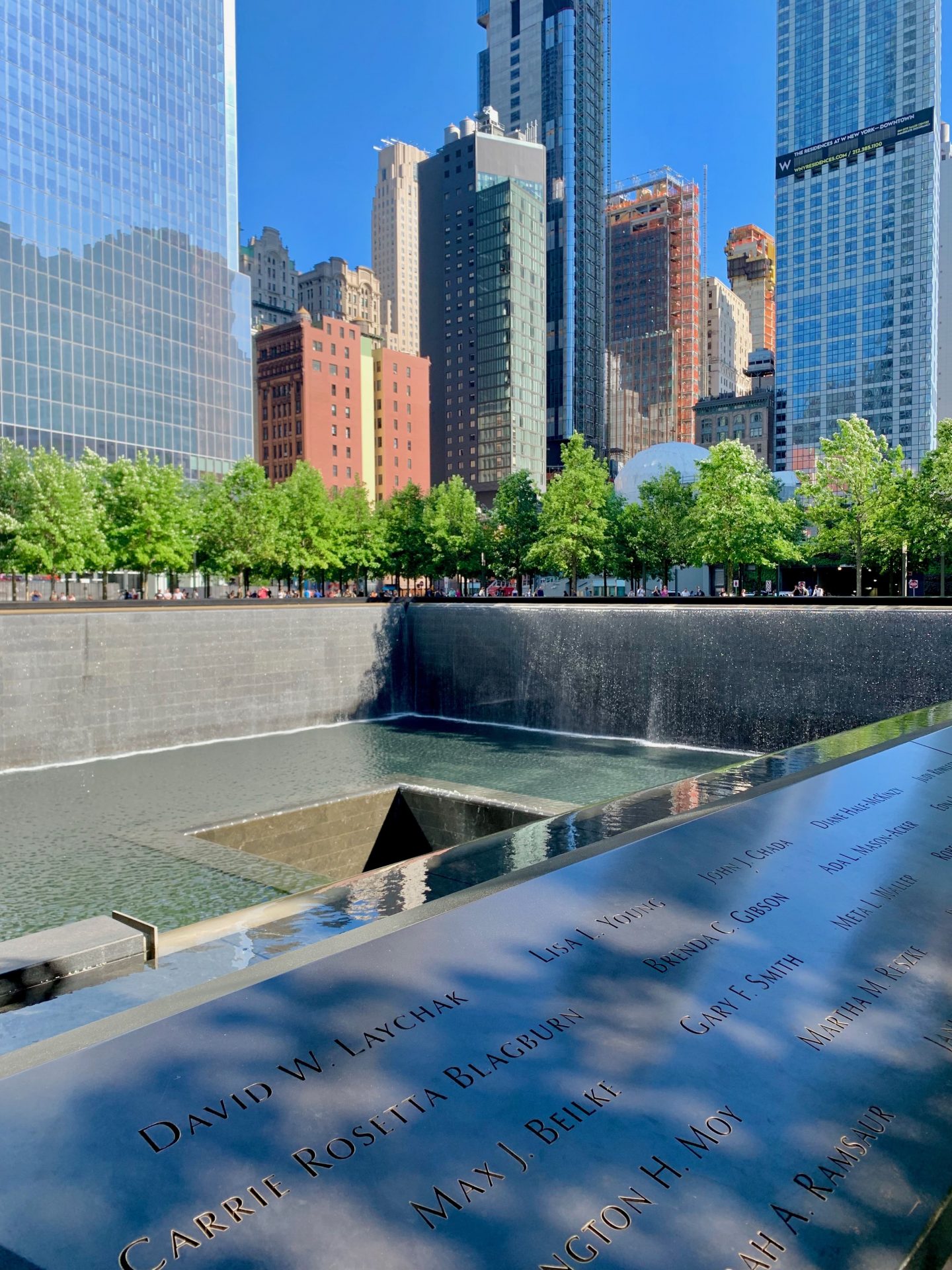 9/11 memorial with engraved names and water feature