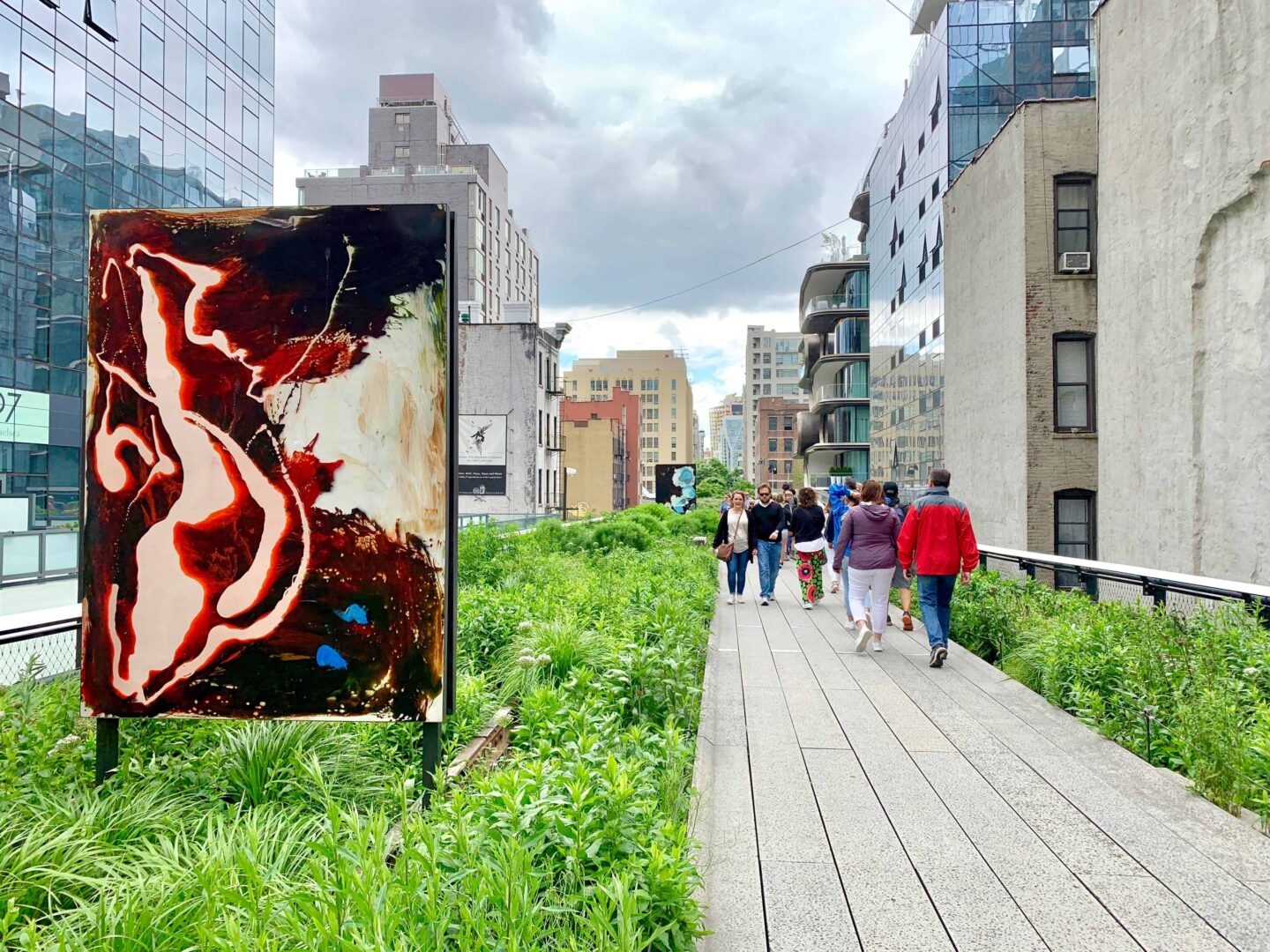 walking the high line and a piece of art in the greenery
