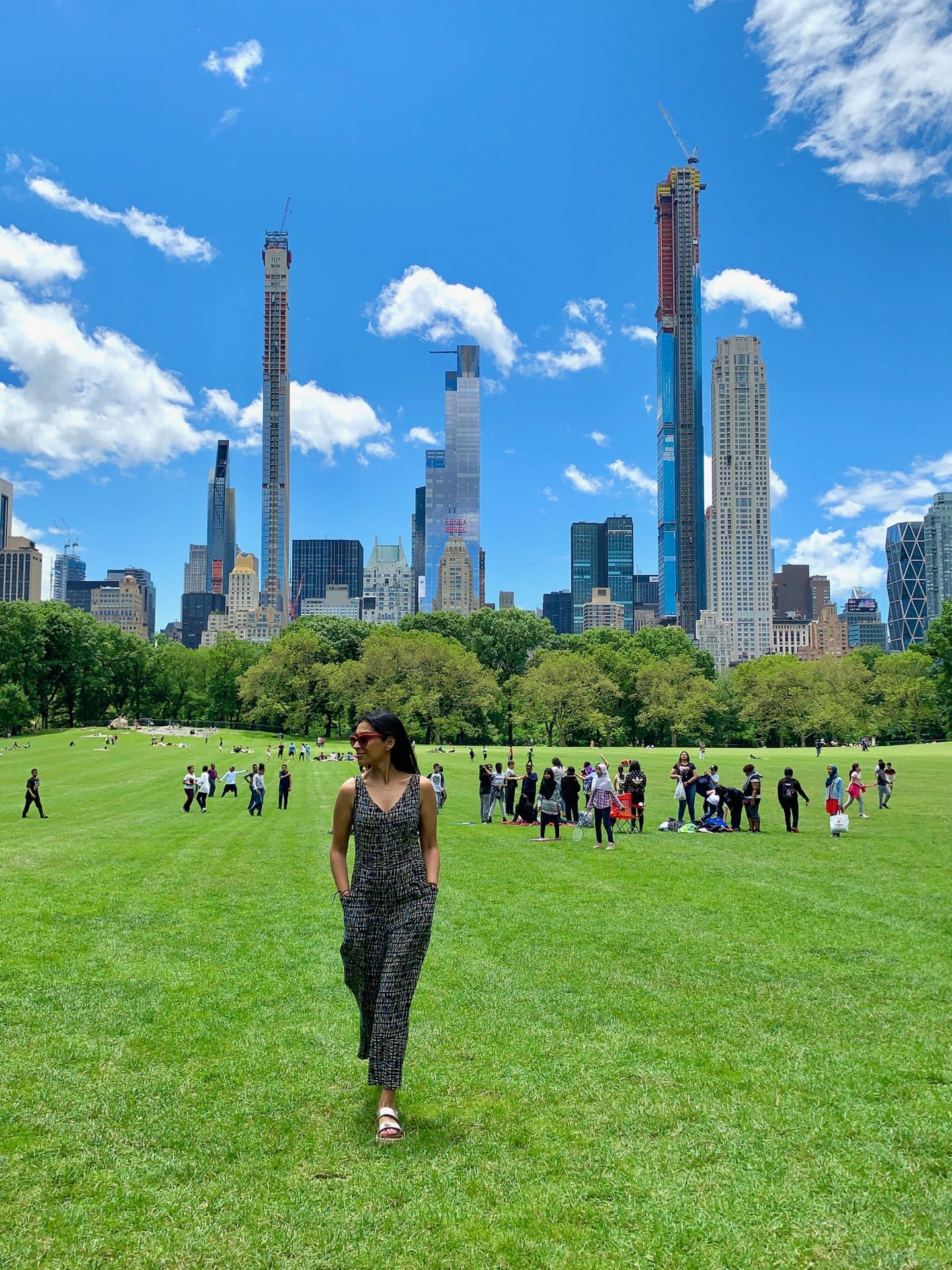 Sima in jumpsuit on grass in Central Park
