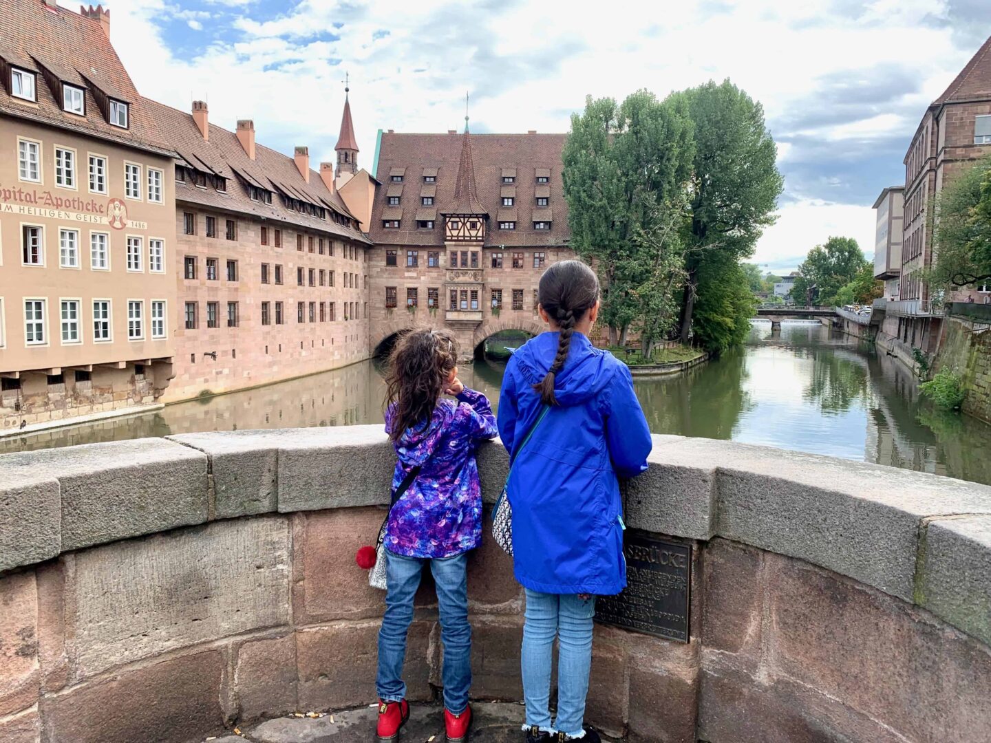 Two girls overlooking the river from the Maxbrücke | Germany with kids