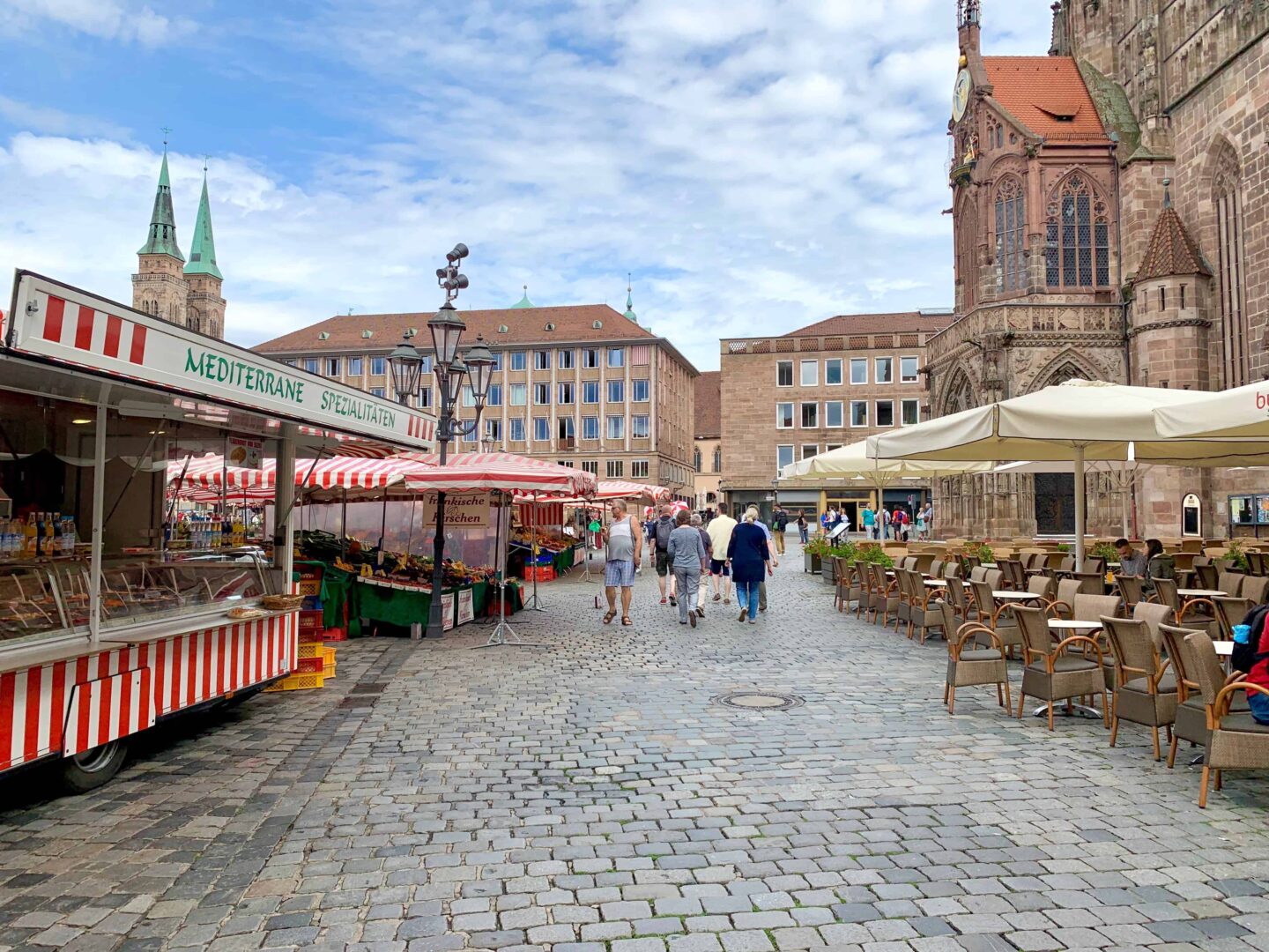 farmers market with tables and chairs and stalls