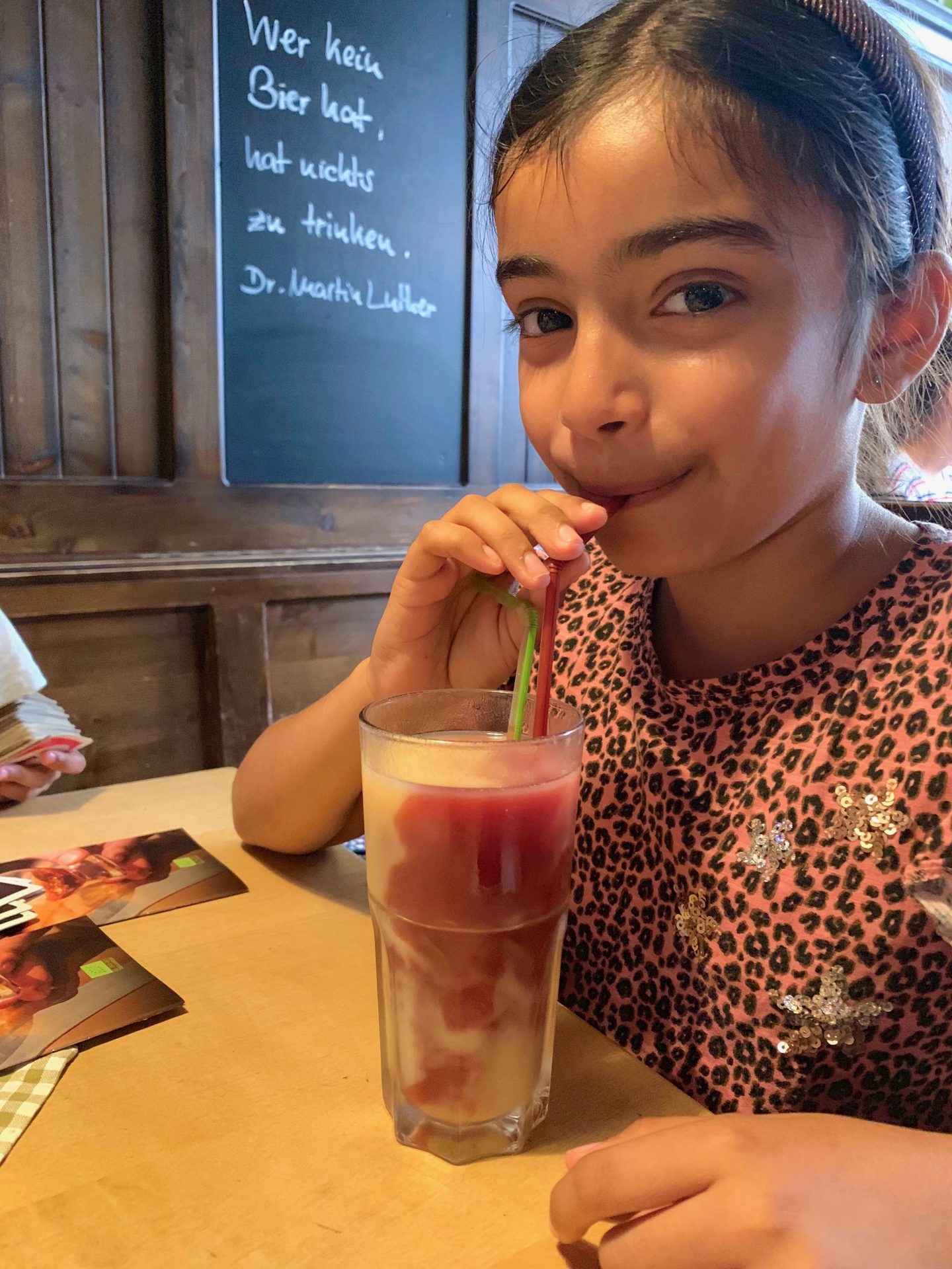 Girl drinking Kiba in Hausbrauerei Altstadthof