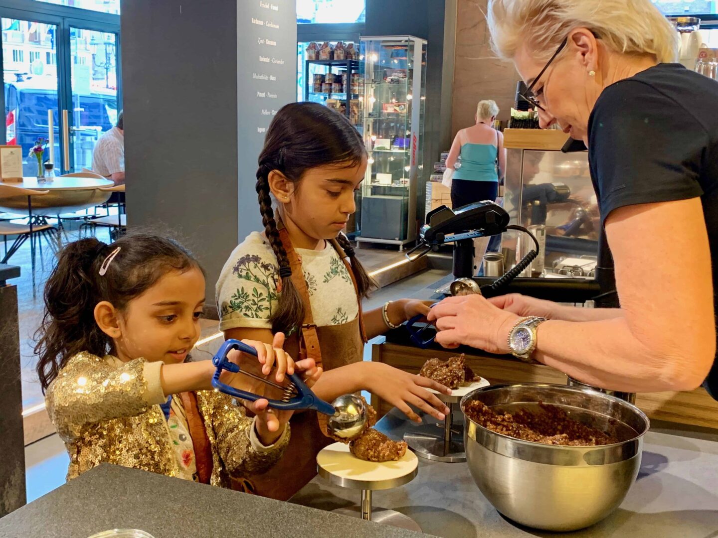 two girls hand making Lebkuchen | Germany with kids