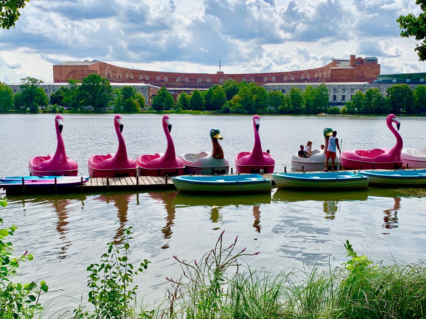 view of duck and flamingo pedalos on a lake