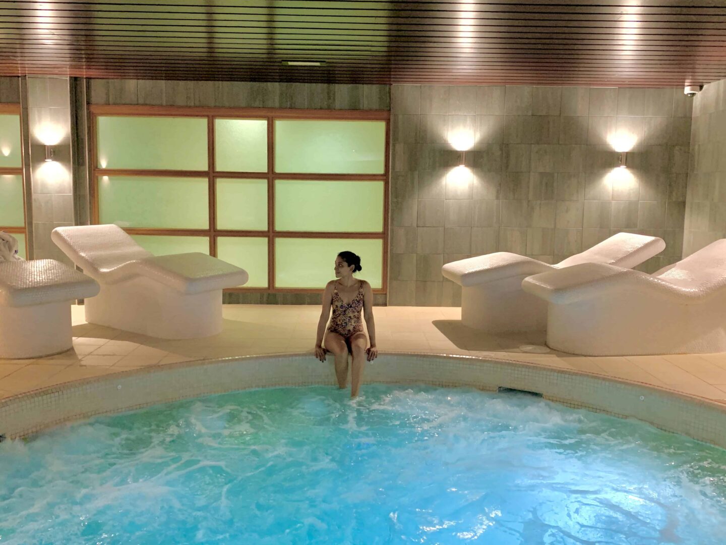 sima sat on the edge of the hot tub in Bicester hotel golf and spa
