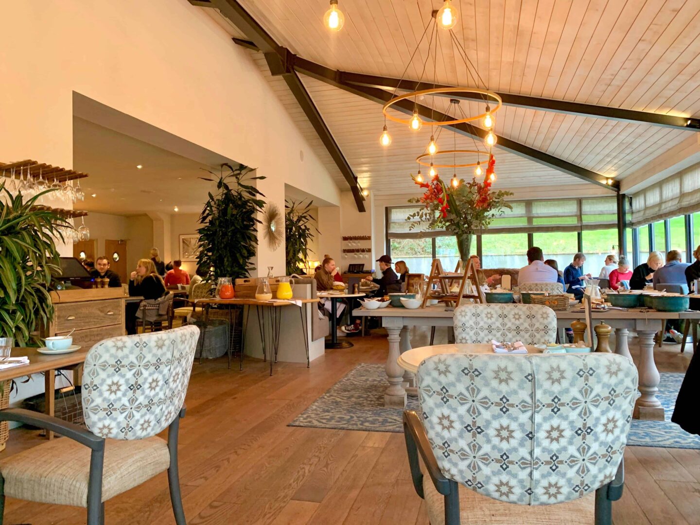 view inside the hook restaurant with wooden roof and tile style seats