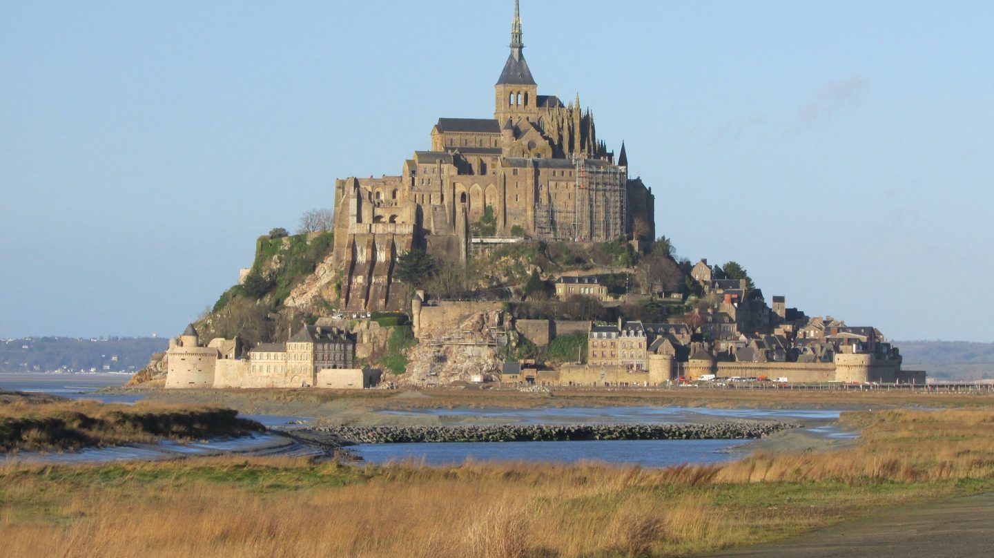 view of Mont St Michel from the shore