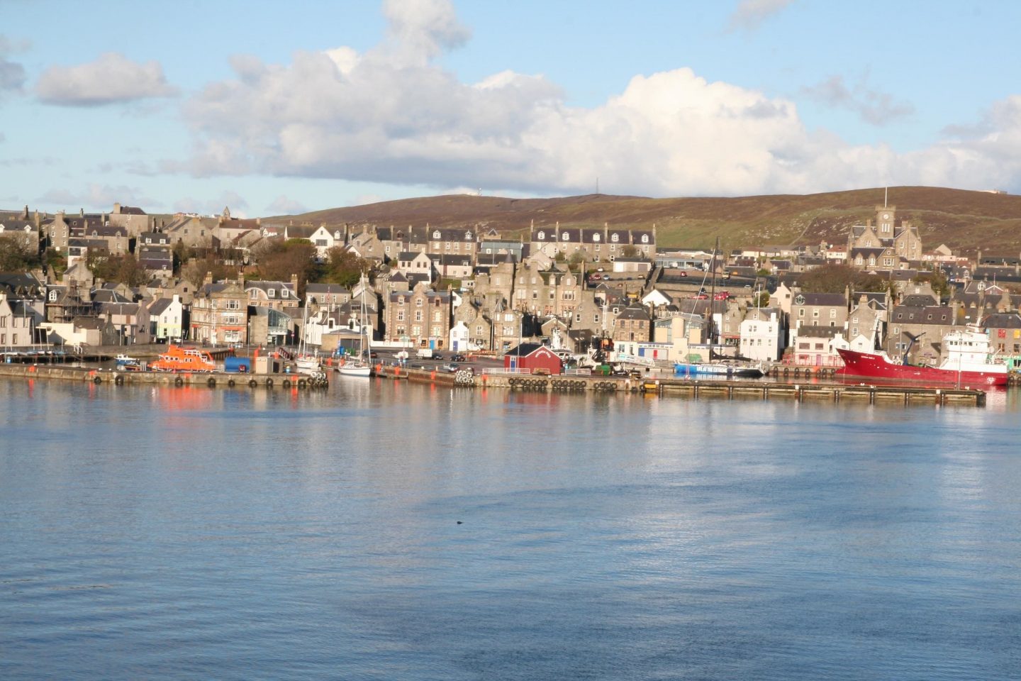 view of shetland village from the sea looking towards the dock