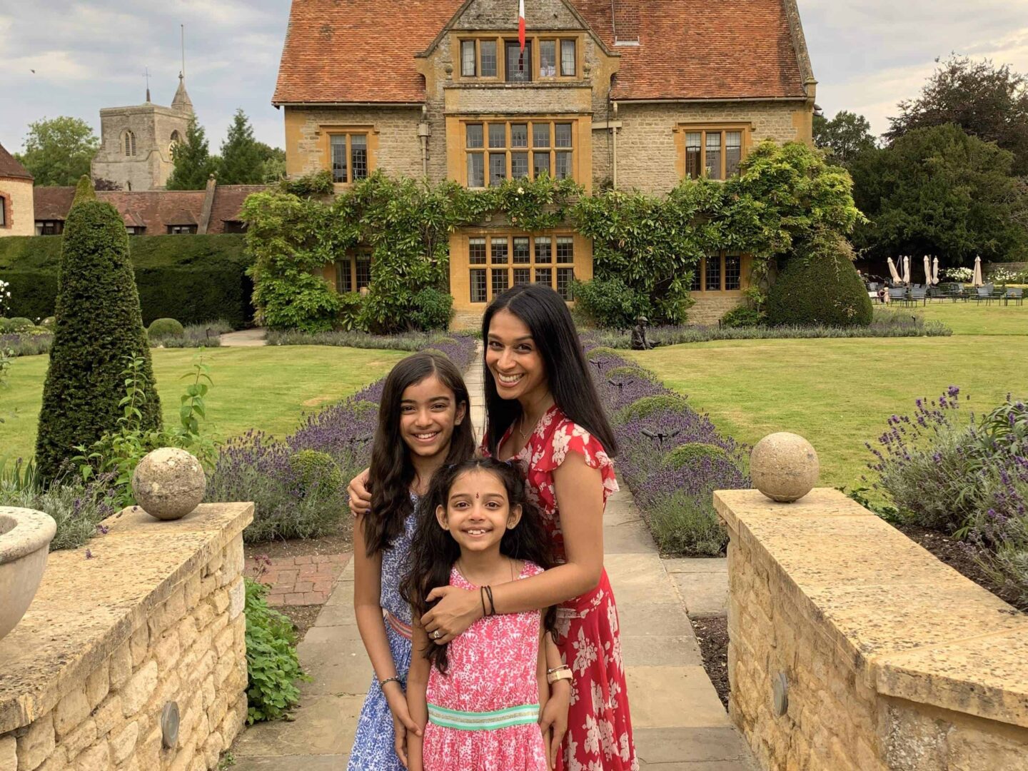 view of sima with two daughters in front of Le Manor Aux Quat'Saisons