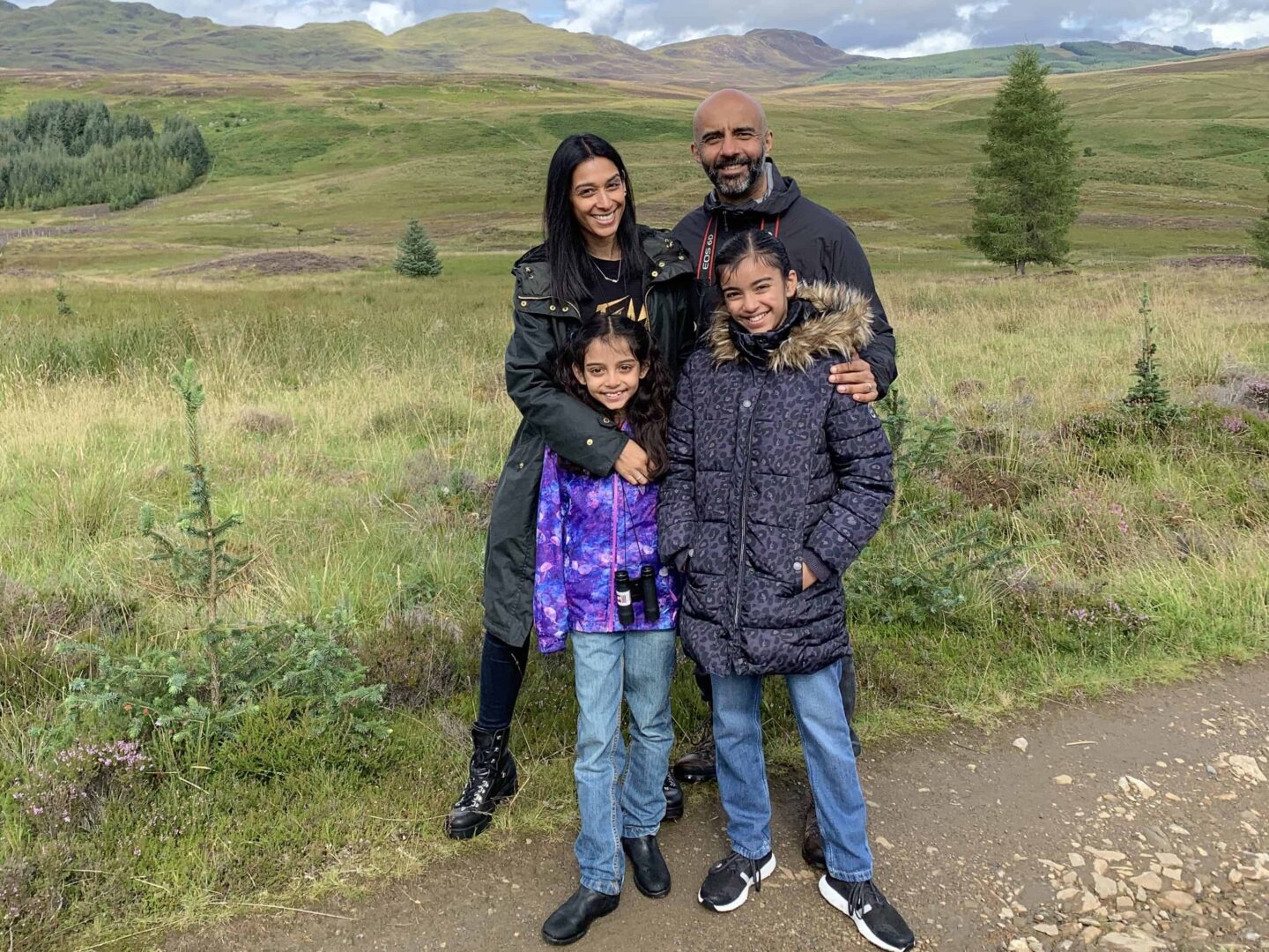view of the family with the highland safaris in the background