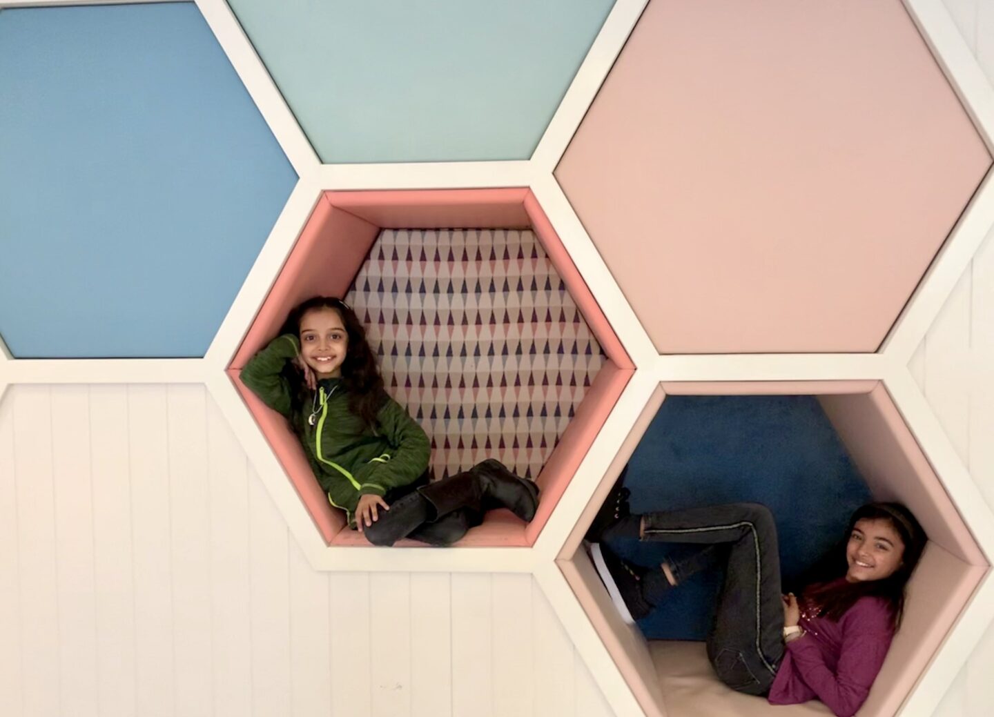 view of the children in the hexagon cushioned chairs in the wall of little glen creche