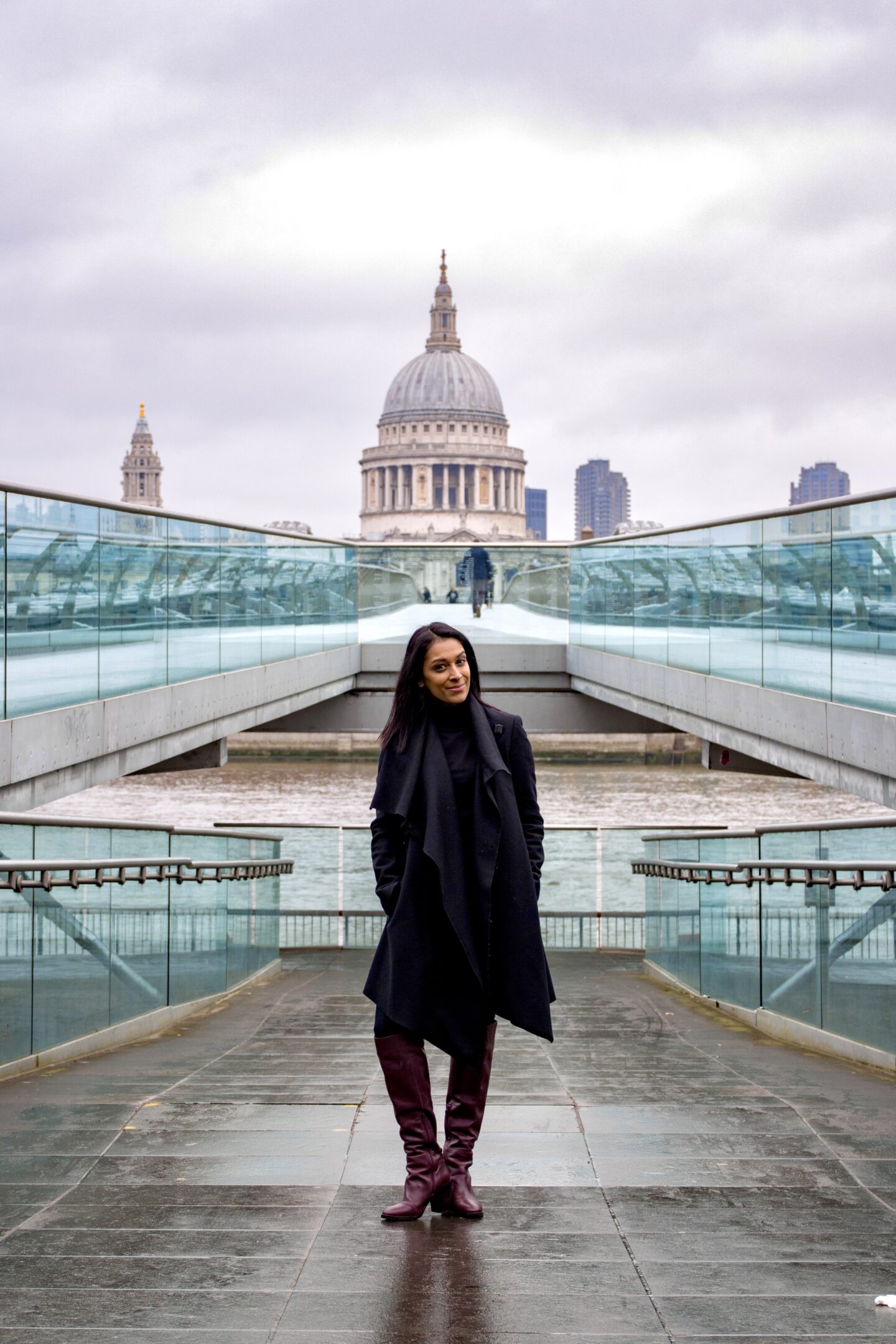 sima stood on the walkway up onto millennium bridge