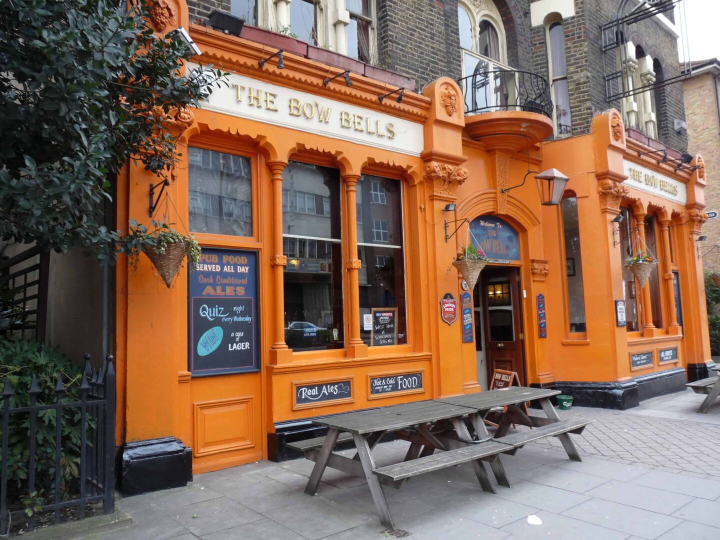 view of the outside bright orange coloured double fronted the bow bells public house