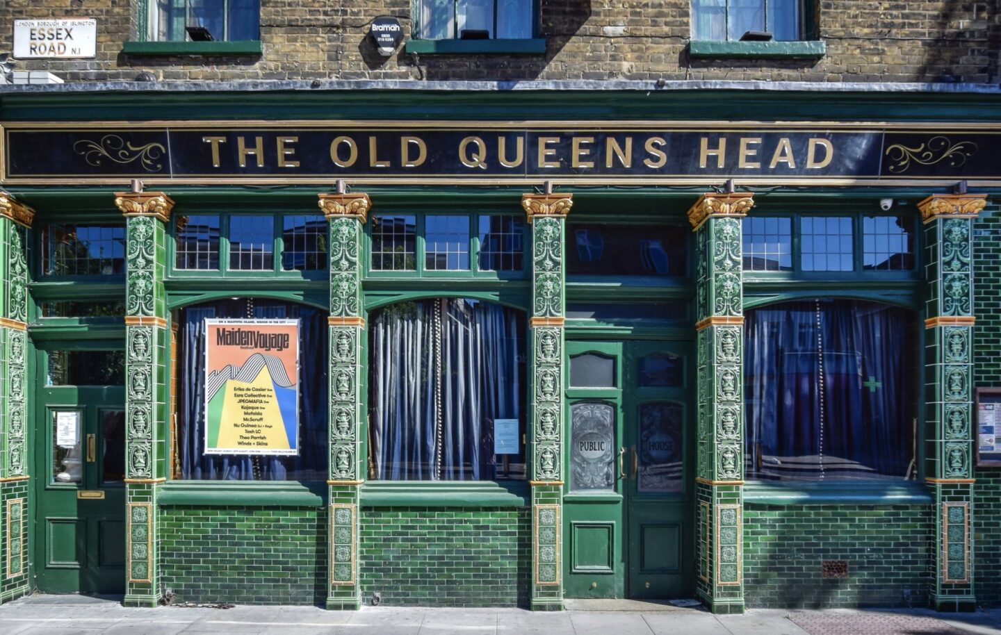 view of the traditional green fronted pub of the old queens head