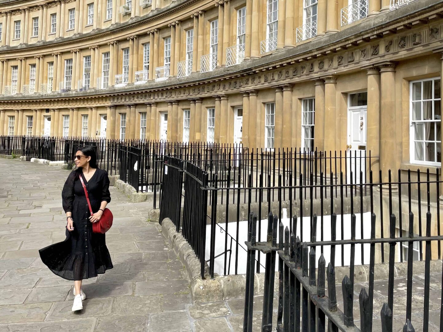 Walking along Royal Crescent in Bath