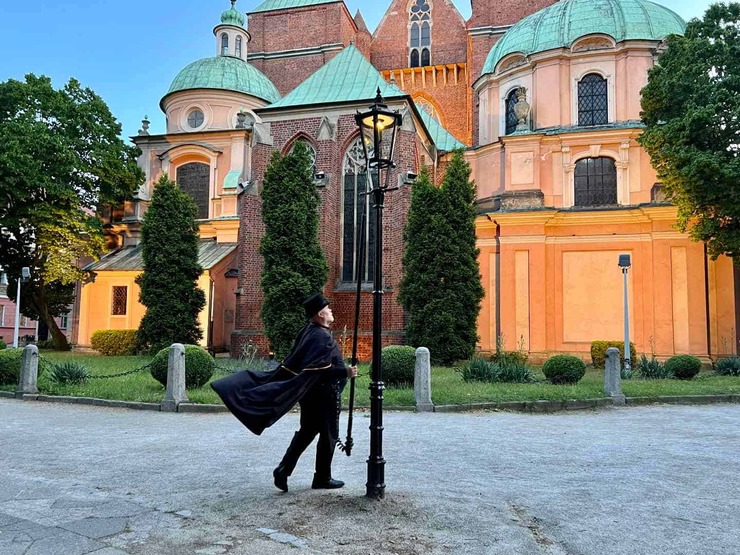 Lamplighter lighting a gas lamp on Cathedral Island